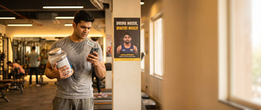Indian man choosing best whey protein under 3000 in gym