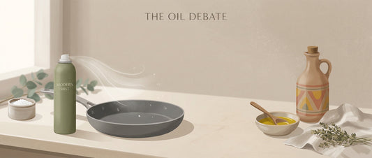 Cooking oil spray and regular cooking oil placed in a kitchen setting for comparison