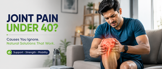 Young professional experiencing knee joint pain while sitting at work, highlighting common causes of joint pain under 40