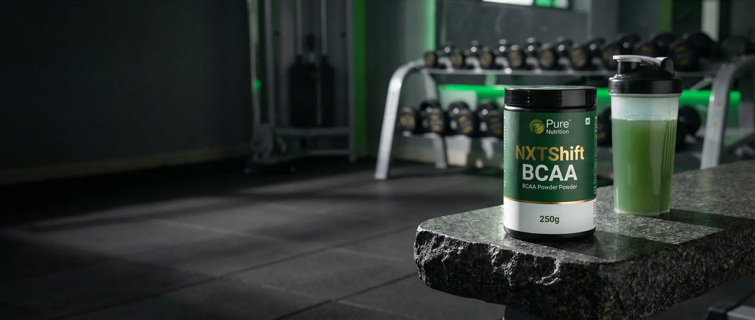NXTShift BCAA powder 250g bottle with electrolytes and taurine placed on a gym bench with Indian gym background Pure Nutrition product review 2026