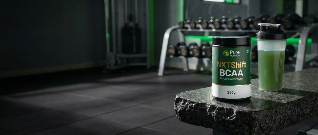 NXTShift BCAA powder 250g bottle with electrolytes and taurine placed on a gym bench with Indian gym background Pure Nutrition product review 2026