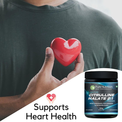 Person holding a red heart model next to Citrulline Malate powder
